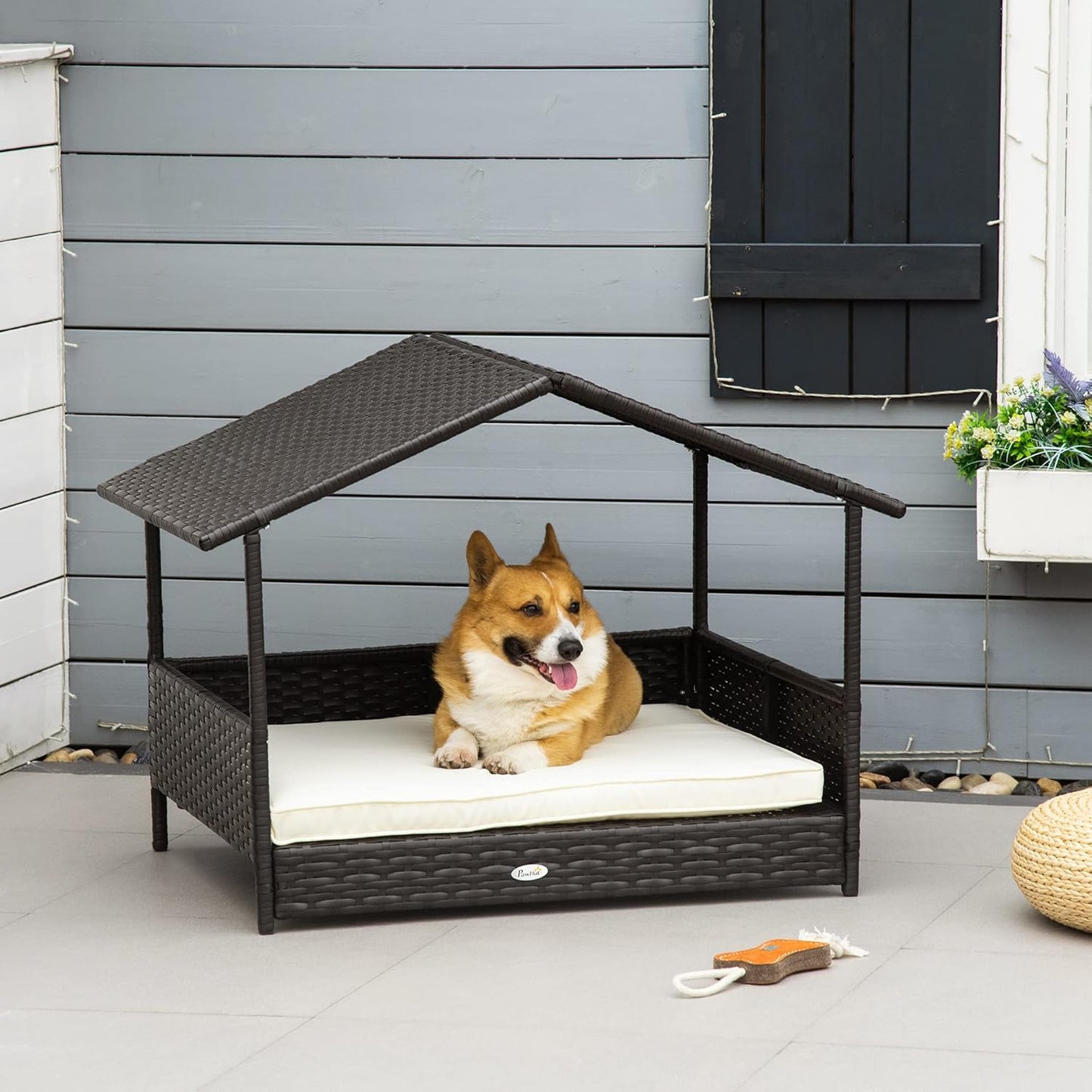 PawHut Wicker Dog House Outdoor with Canopy, Rattan Dog Bed with Water-Resistant Cushion, Raised Dog Bed for Small, Medium Dogs up to 66 lbs, 19.75" in Length, Brown Wicker, White Cushion